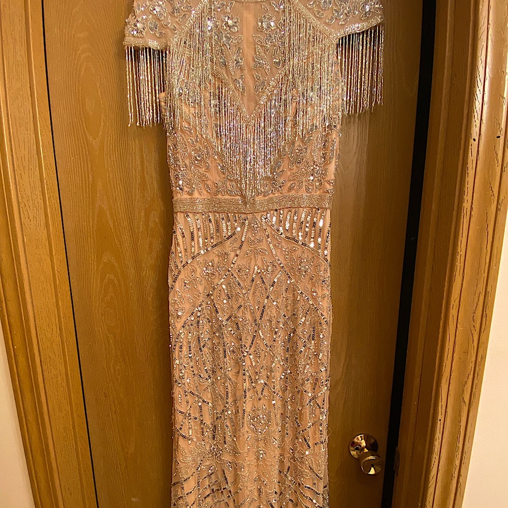 Mac Duggal gown size 4.Can fit a size 6.Worn once.